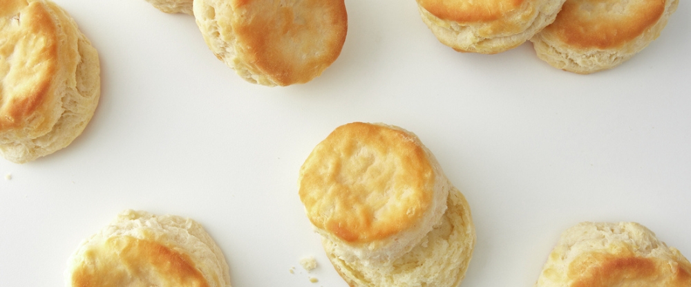 Biscuits scattered across white background